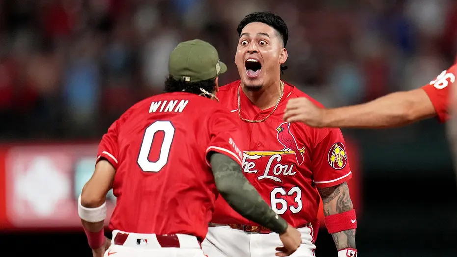 Cardinals fans in an empty section create electric scene during walk-off win over Royals