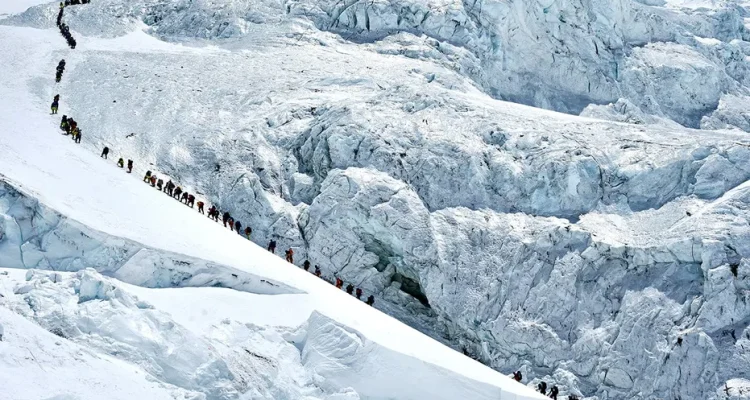 Record Climbers Reach Everest Summit from Nepal Amidst Overcrowding Worries