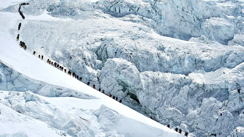 Record Climbers Reach Everest Summit from Nepal Amidst Overcrowding Worries