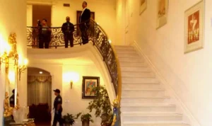 What led to a wealthy widow's death at the foot of her mansion's stairs?