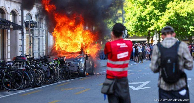 G7 Protest Turns Violent, Demonstrators Torch Tesla, Smash UN Office