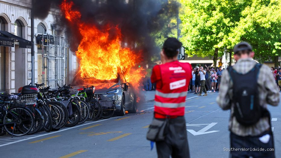 G7 Protest Turns Violent, Demonstrators Torch Tesla, Smash UN Office