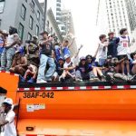 Knicks Fans Scale Vehicles, Many Locked Out of Packed Parade