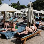 Stampede for Pool Chairs After Long Wait at Resort
